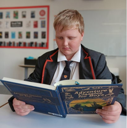 A child reading a book

Description automatically generated