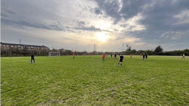 A group of people playing football

AI-generated content may be incorrect.