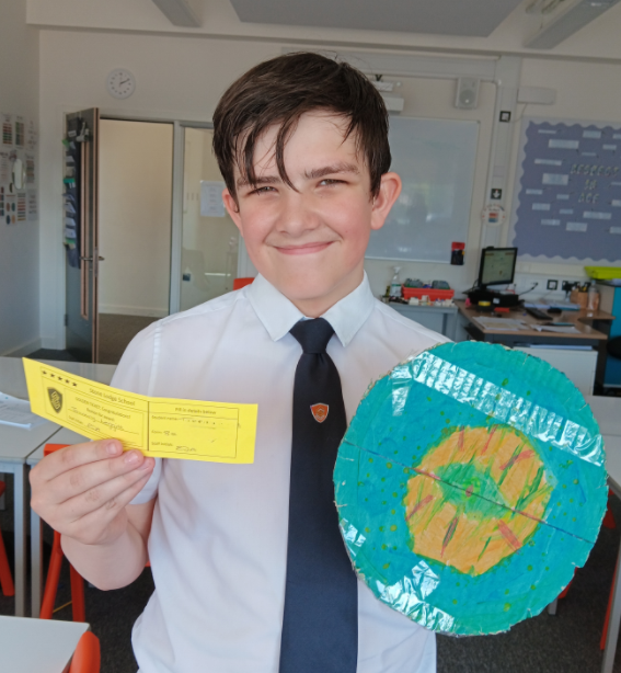 A child holding a piece of paper and a piece of paper

AI-generated content may be incorrect.