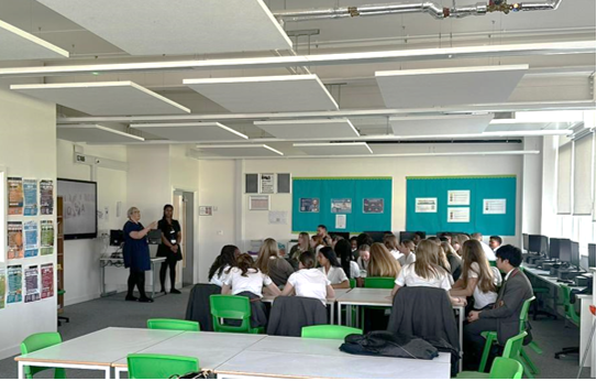 A group of people in a classroom

AI-generated content may be incorrect.