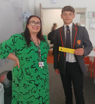 A person in a green dress and a child in a suit

AI-generated content may be incorrect.