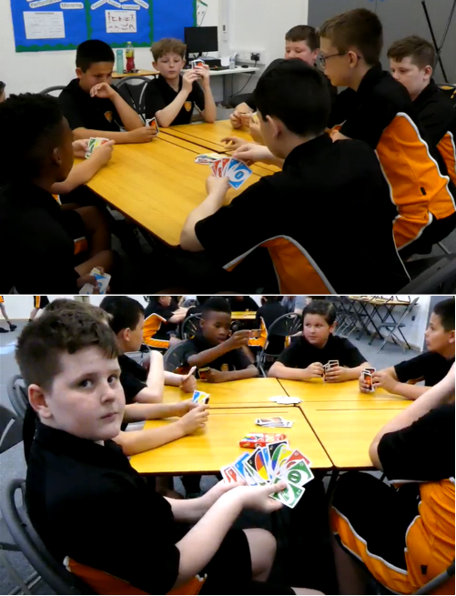 A group of kids playing cards
AI-generated content may be incorrect.
