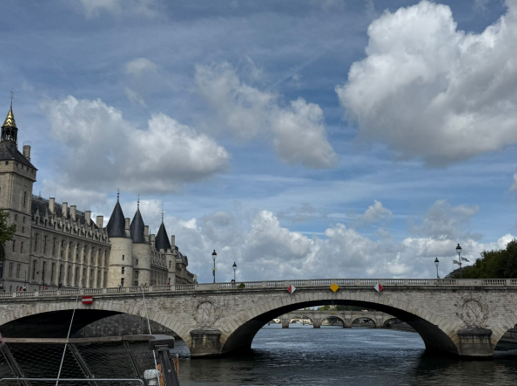 A bridge over water with a castle in the background
AI-generated content may be incorrect.