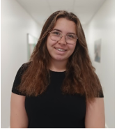 A person wearing glasses and smiling

AI-generated content may be incorrect.