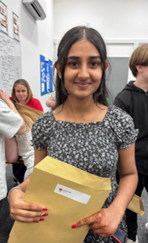 A person holding a brown envelope
AI-generated content may be incorrect.