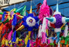 A group of colorful pinatas from a ceiling

AI-generated content may be incorrect.