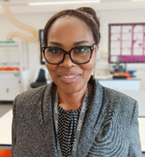 A person wearing glasses and a grey jacket

AI-generated content may be incorrect.