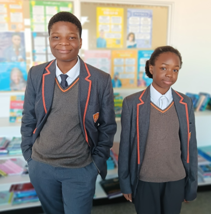 A couple of students in uniform
AI-generated content may be incorrect.