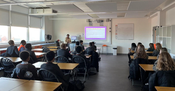 A person standing in front of a classroom
AI-generated content may be incorrect.