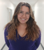 A person wearing glasses and smiling

AI-generated content may be incorrect.